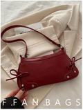 Cartera burdeos de cuerina con lazos - 6180