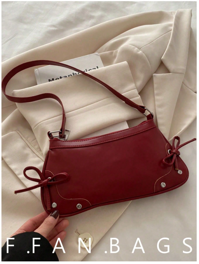 Cartera burdeos de cuerina con lazos - 6180