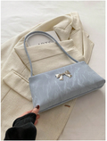 Cartera azul con decoración de lazo metálico - 6181